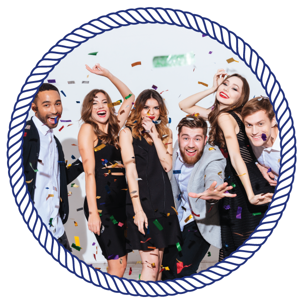 group of friends, smiling towards the camera, with confetti surrounding them