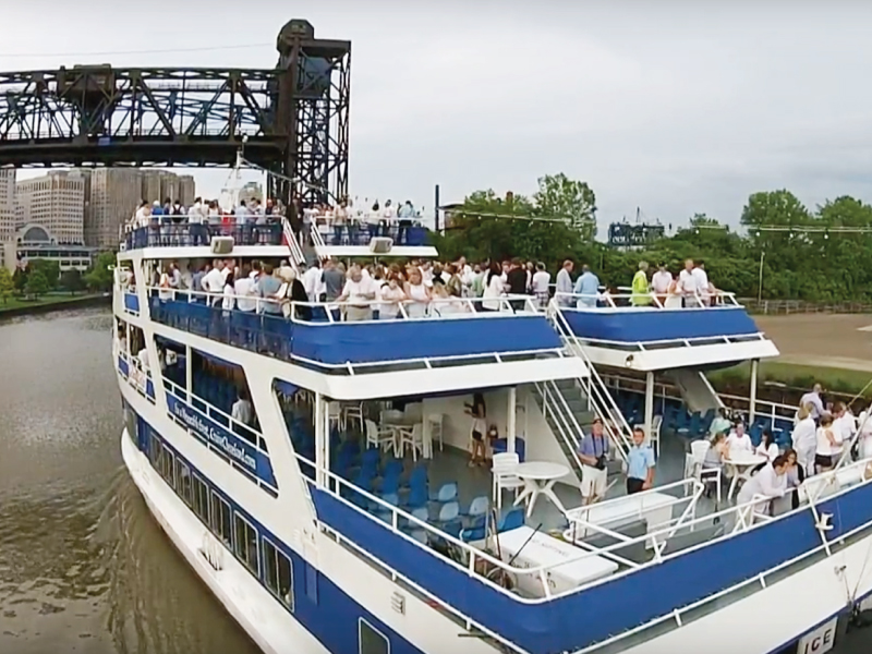 goodtimeiii boat with lots of passengers, cruising down the river