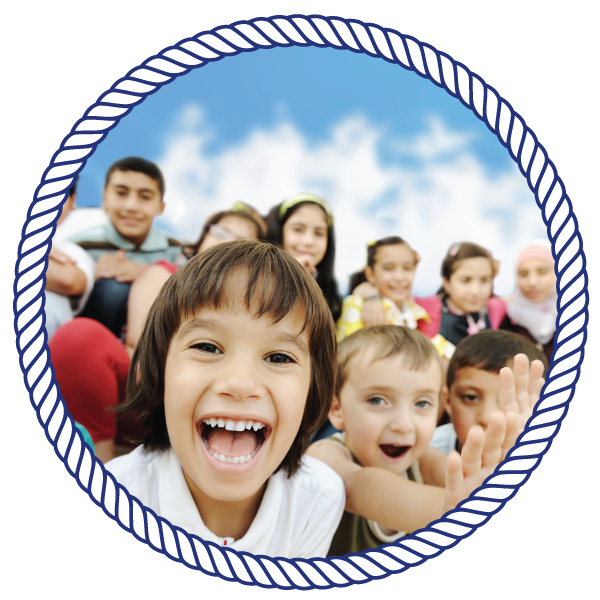group of kids smiling towards the camera