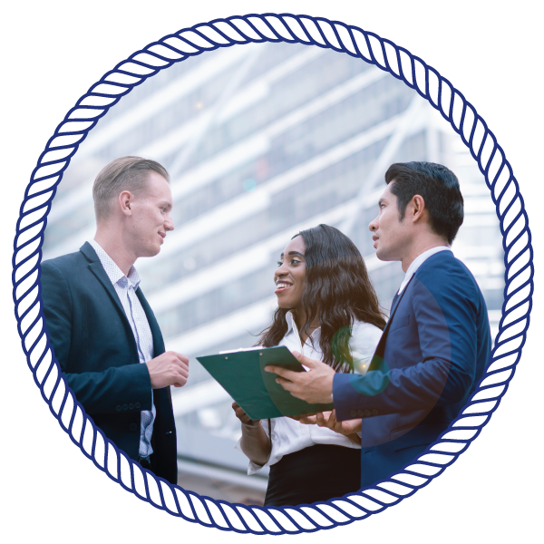Conferences & Conventions business partners talking, while holding a clipboard
