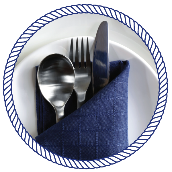 Dining Cruises utensils on a napkin, on a plate