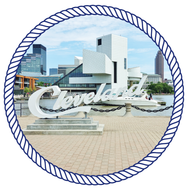 Sightseeing Cruise artistic buildings, with the sign "cleveland" on a pier