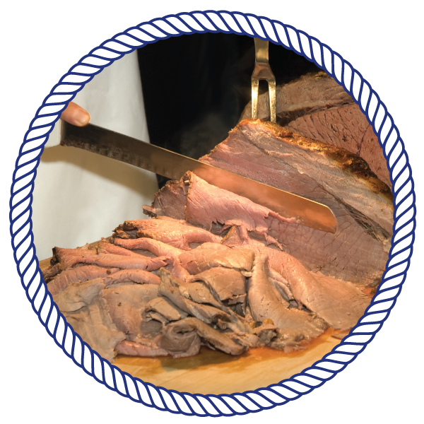 chef cutting into meat, with a fork and knife