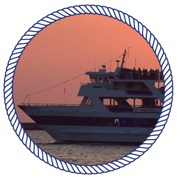 Unique Event Space goodtimeiii boat, out on the water, with a sunset in the background