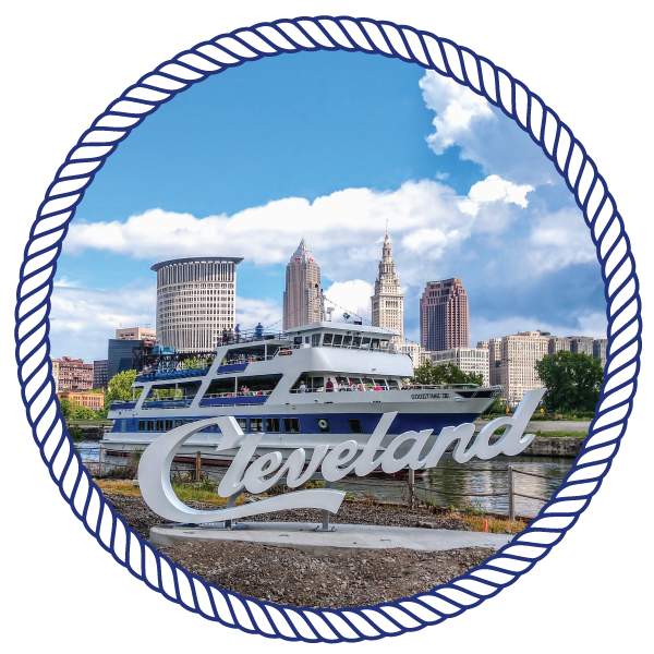 a sign "cleveland" on a mount, with the goodtimeiii boat in the background