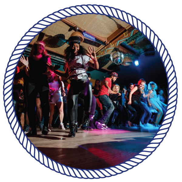 group of people dancing on a dance floor