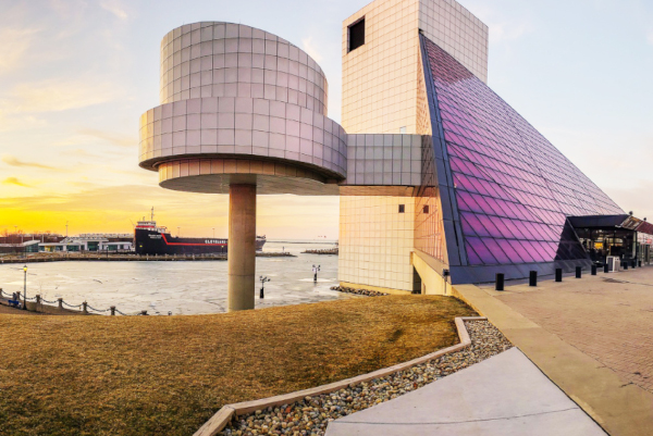 artistic style building, with a sunset in the background